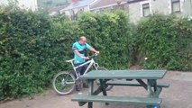 Drunk guy trying to ride his bicycle! FUNNY...