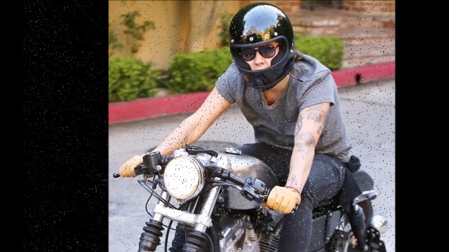 Harry Styles goes into biker mode as he zips through the streets of Los Angeles (HD)