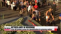 First bodies of MH17 victims arrive in Netherlands