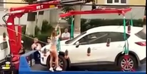 Woman attempts to get clamped car back