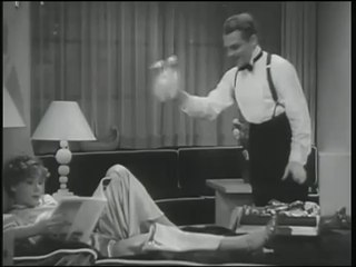 James Cagney shows Mae Clarke the door