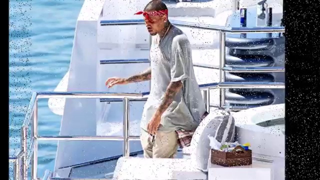 Chris Brown shows off his moves as he parties on a yacht