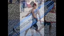 Siva Kaneswaran goes shirtless as he catches some waves at Venice Beach