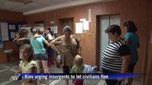 Ukraine closes in on rebel bastion, urges civilians to flee