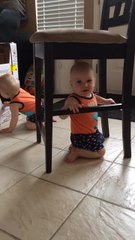 Baby stuck under chair comes up with genius idea