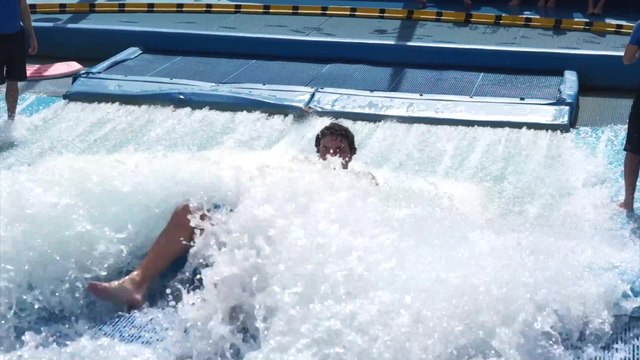 Amateur Surfers Wiping Out on a Surf Machine