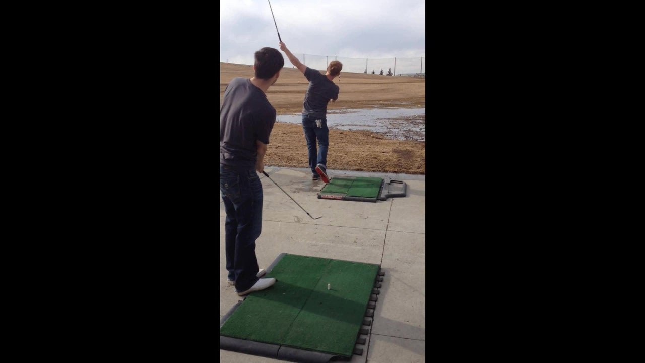 Two Friends Pull Off Incredible Golf Trick Shot
