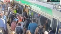 Commuters Push Train Off Trapped Man