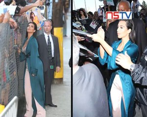 Kim Kardashian shows off ample cleavage in low-cut