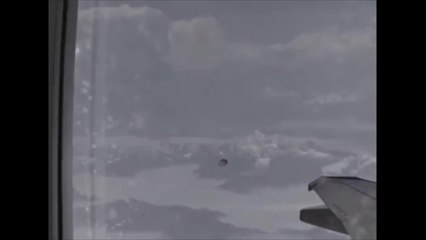 UFO follows an airplane over the Himalayas
