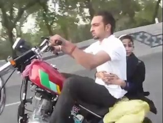 One wheeling with girl friend in lahore