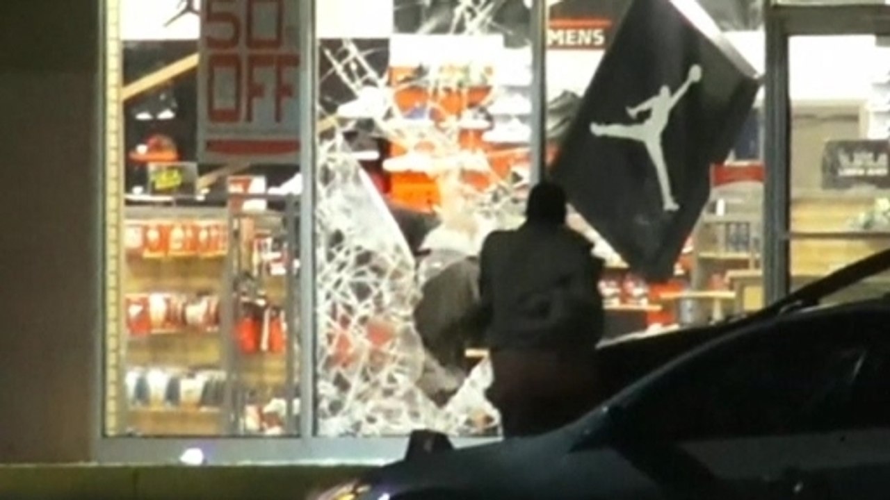 Riots, looting erupt after fatal shooting of unarmed black teen