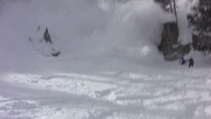 Avalanche rips snowboarder off huge cliff