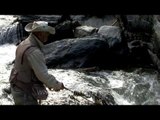 Angler uses rod and reel for fishing in Kashmir