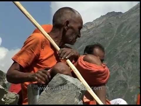 Sadhus in saffron clothes rest along the way: Amarnath Yatra