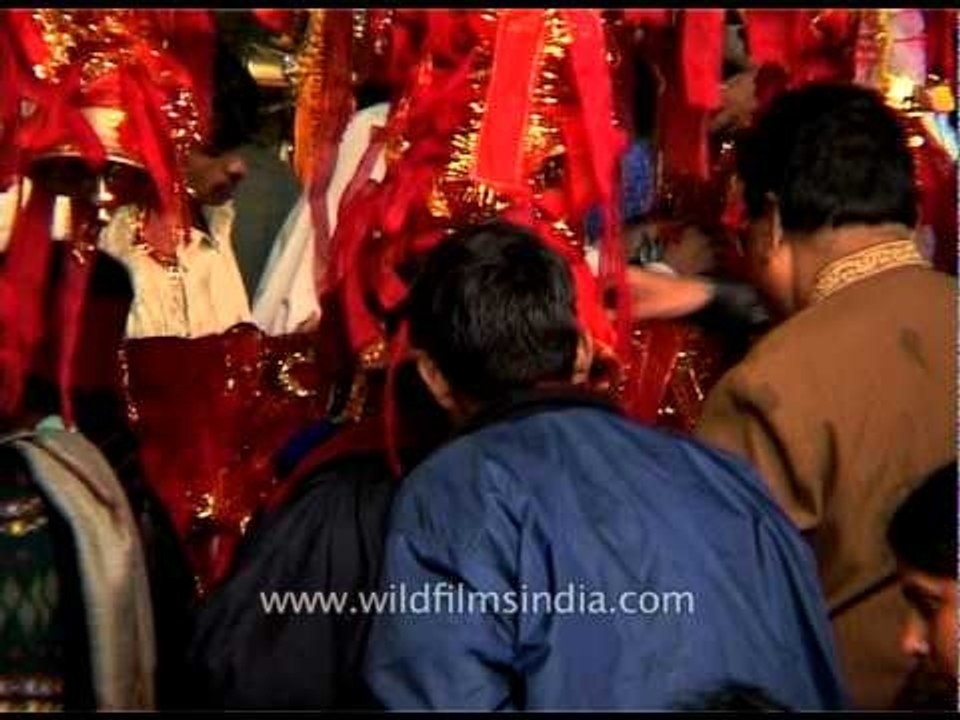 Hindu devotees ring temple bells as they visit Amarnath Temple
