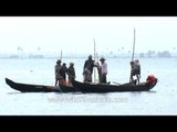 Local boatmen fishing on Vembanad Lake - Kerala