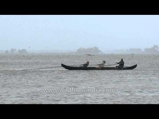Fishermen pulling fishing net  - Vembanad Lake, Kerala