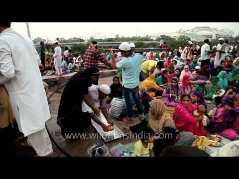 Muslim devotees break iftar at Feroz Shah Kotla Fort mosque