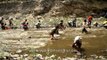 Himalayan villagers crowd river to catch all the fish in it