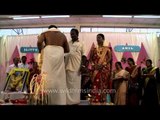 Couple performing rituals: Kerala wedding