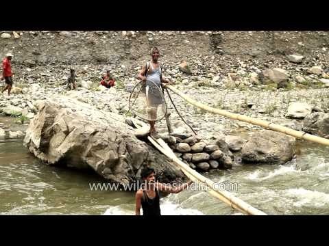 Participants with fishing net cross makeshift bridge - Maund mela