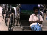 Hand-drawn rickshaws on roads of Kolkata