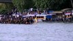 Men rowing during a traditional boat race in India - Champakulam Boat race