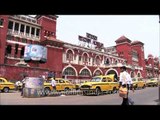 Passengers get into taxi outside Howrah railway station, Kolkata