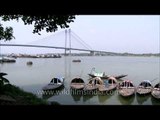 Boats in Hooghly River and seen far behind is Vidyasagar Setu