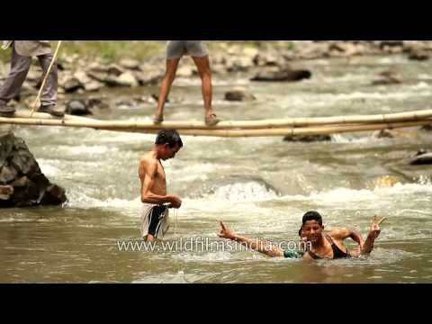 Villagers splashing around in River Aglar during Maund mela