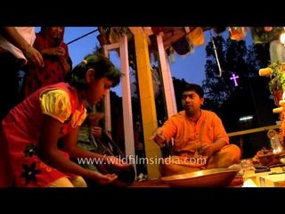 Devotees climb the chariot of Lord Jagannath