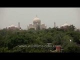 Taj Mahal as seen over Agra city roads and forest cover