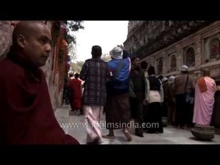 Tibetan man seeks alms during Kalachakra at Bodh Gaya