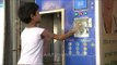 Young boy uses Swajal water vending machine: Rs. 1 per litre