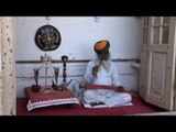 Rajasthani man smokes hookah the traditional way