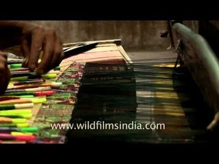 Artisans work at handloom factory in Varanasi