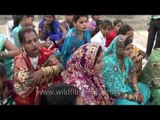 Women singing holy hymns on the occassion of Chhath Puja, Delhi