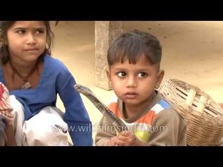 These children play with snakes on a daily basis