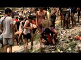Villagers from nearby villages participate in fish killing festival