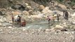 Villagers cross makeshift bridge in Uttarakhand to kill all the fish in the river