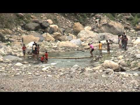 Villagers cross makeshift bridge in Uttarakhand to kill all the fish in the river