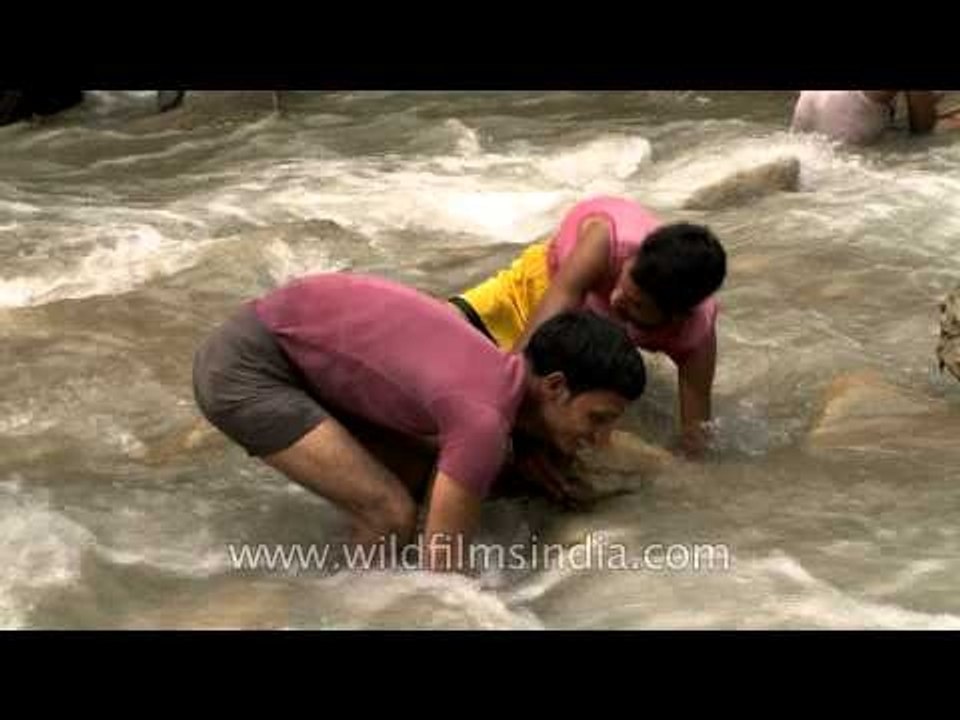 Villagers fishing in river Aglar during Maund mela
