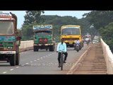 Vehicles travel along the Mahanadi Road Bridge in Cuttack, Odisha
