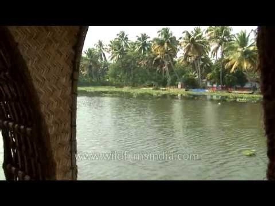 Houseboat drifts along backwaters of Kerala