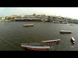 Boat traffic on Chao Phraya river in Bangkok, Thailand