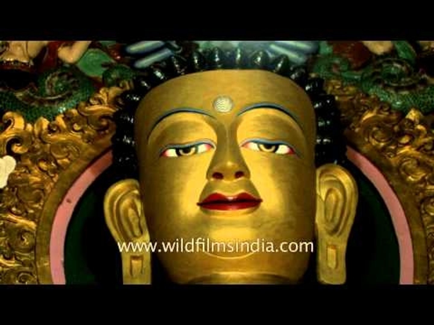 Gilded metal statue of preaching Buddha in Sarnath