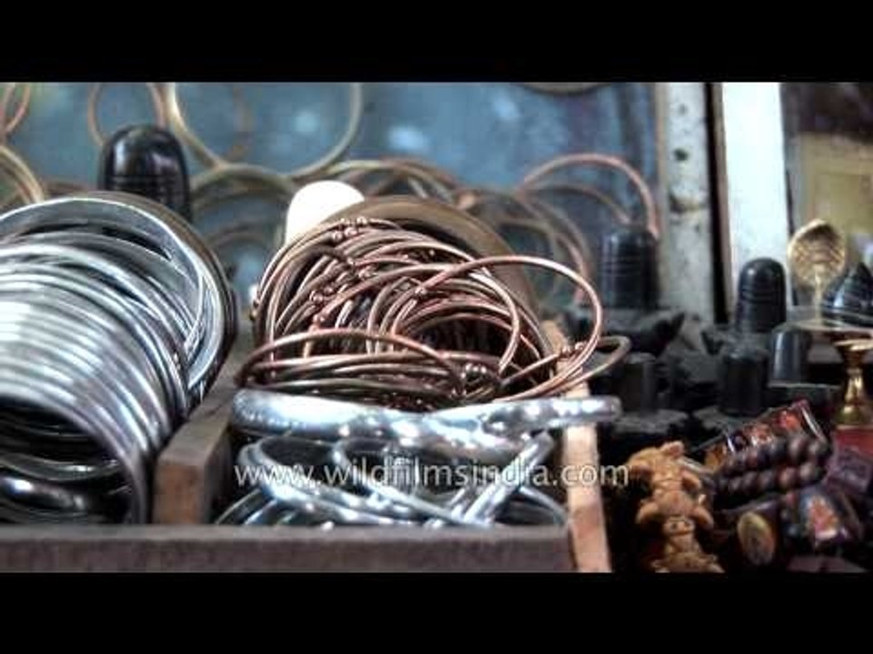 Baba sells Hindu rosaries in the local market of Haridwar