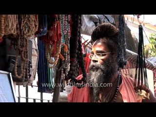 Baba waits for customers - Haridwar market
