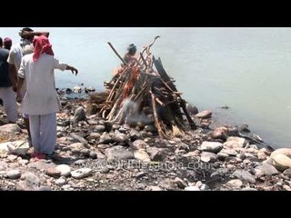 Performing rituals before burning a pyre